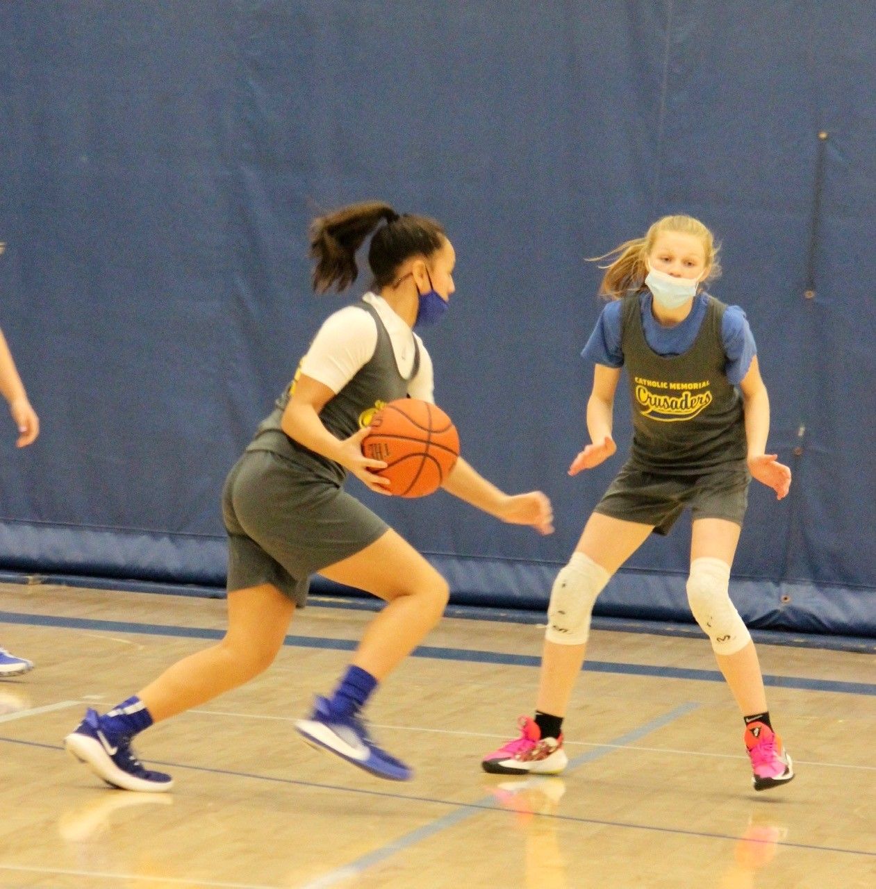 Junior Crusader Girls Basketball Team dribbles the ball
