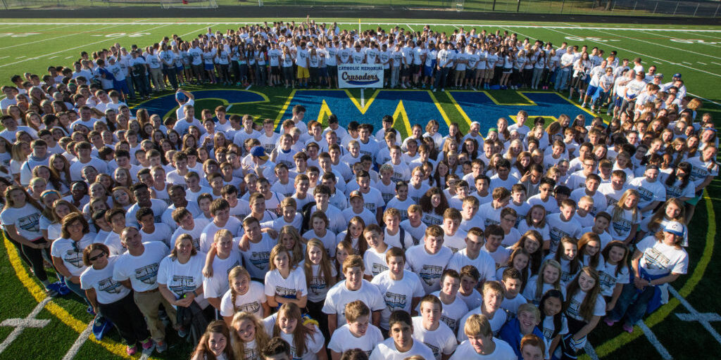 CMH students stand together on football field