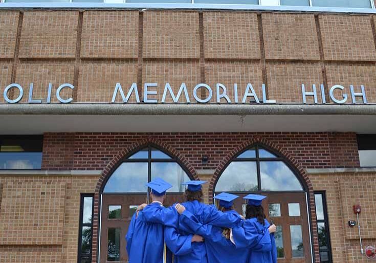 CMH students stand in graduation gowns